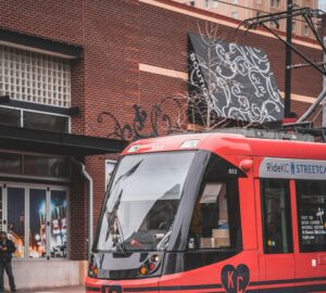 red and white tram on road during daytime