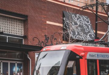 red and white tram on road during daytime