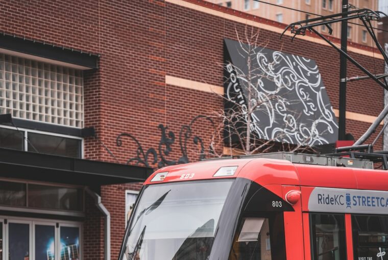 red and white tram on road during daytime